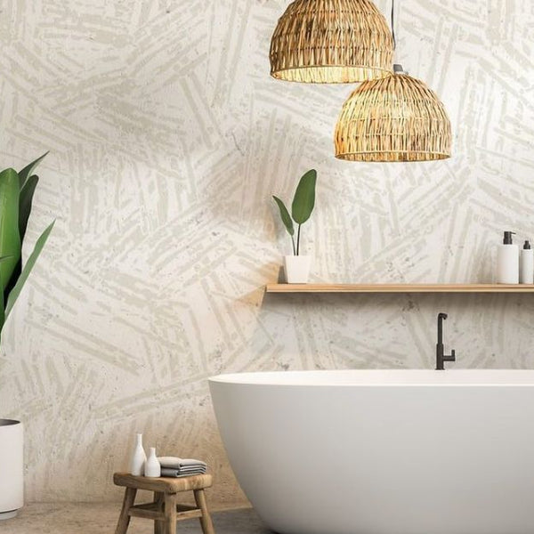 Close-up of a hand aligning wallpaper pattern